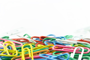 Paper clips colorful with copy space on top on white background.