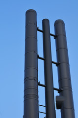high chimney pipes of dark metal