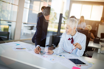 Businesspeople discussing together in conference room during meeting at office