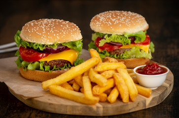 Burger with French fries cutlet with cheese and tomato