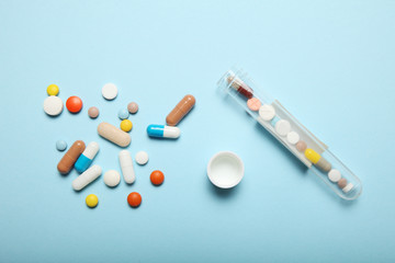 Pills and drug addiction. Medical colorful capsules.