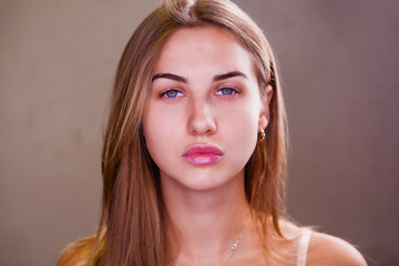 Young blonde woman without makeup