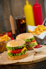 Burger with French fries cutlet with cheese and tomato