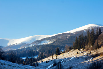Fototapeta na wymiar Winter mountain landscape. Mountains in the snow. The first snow in the mountains.