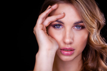 Closeup portrait of beautiful model with long blond hair