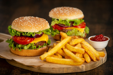 Burger with French fries cutlet with cheese and tomato