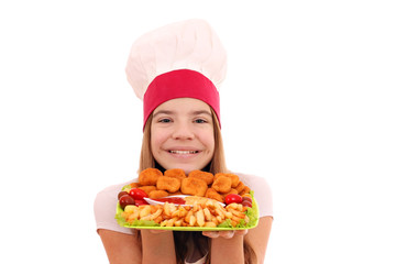 Happy girl cook with chicken nuggets and french fries on plate