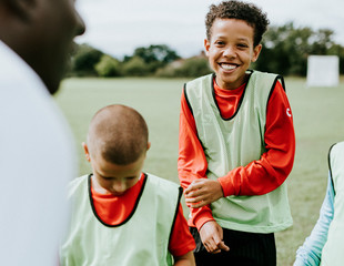 Football coach training his students