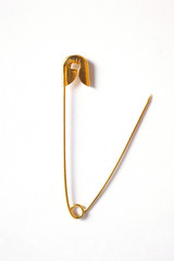 open safety pin isolated on white background with copy space for your text