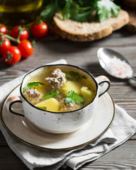 Soup with meatballs. Rustic style