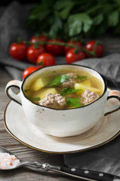 Soup with meatballs. Rustic style