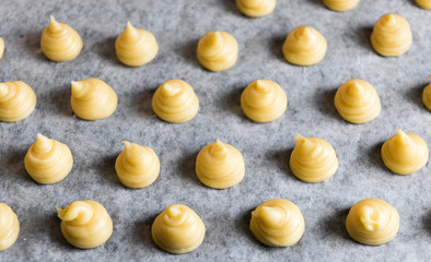 Piped Choux pastry on a tray