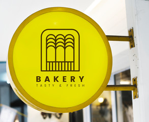 Bakery store's yellow shop sign mockup