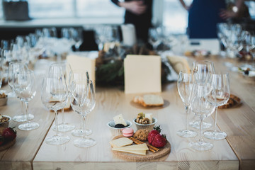 Table setting with wine and snacks, etiquette and event