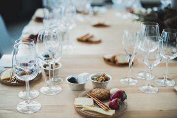 Table setting with wine and snacks, etiquette and event