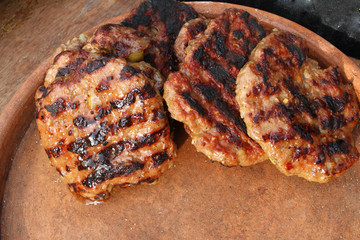 Meatball roasted on a barbeque. BBQ. Grilled burgers with copy space. fast food background. Menu wallpaper. 