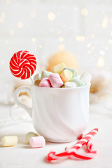 Merry Christmas and happy New year. Cup of cocoa and marshmallows on a light background. Christmas background.