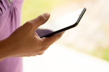 girl hold the phone outside