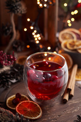 Fototapeta premium Glass of mulled wine with cranberry. Christmas or New Year drink