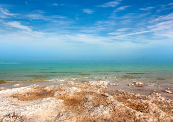 Fototapeta na wymiar The shore of the Dead sea is going into the horizon.