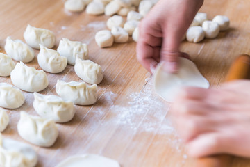Fototapeta na wymiar The process of making dumplings