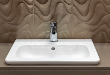 Fototapeta premium Fragment of bathroom with sink and faucet