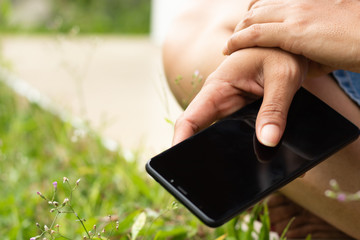 girl hold the phone outside