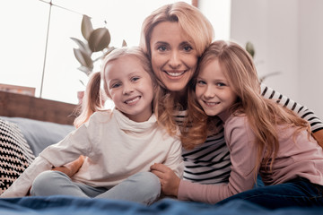 Kids and mother looking at you