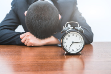 The tired young man with an alarm clock.