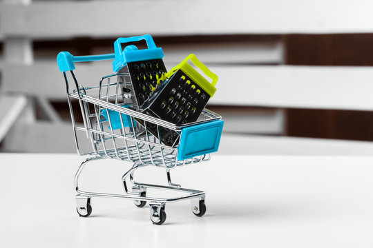 Mini Shopping Cart On The Table. Business , e-commerce concept