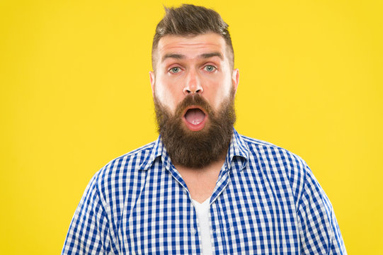 Man bearded hipster with sneezing face open eyes close up yellow background. Brutal hipster sneezing. Allergy concept. Take allergy medications. Can not stop sneezing. I am going to sneeze