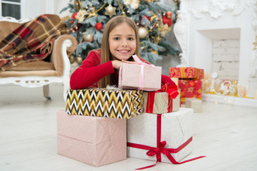 Obraz na płótnie Canvas Child enjoy the holiday. Fill our Christmas with joy and cheer. The morning before Xmas. Little girl. Christmas tree and presents. Happy new year. Winter. xmas online shopping. Family holiday