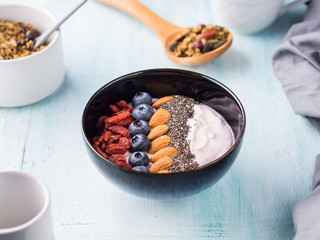 Yogurt smoothie bowl with berries, nuts, chia
