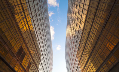 Modern office building on a clear sky background at sunset. Golden hour. Futuristic modern architecture building