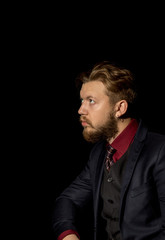  man with a beard on a black background