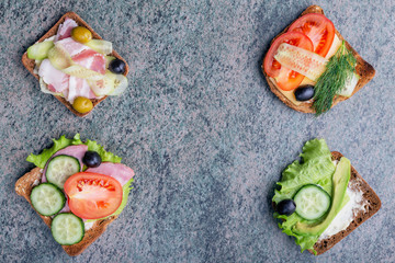 toasts with healthy vegetables for breakfast on wooden background