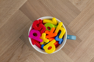 Colourful lettering in a cup