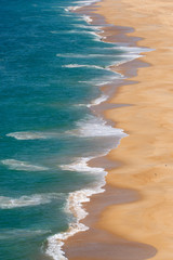 Soft blue ocean wave on sandy beach. Background