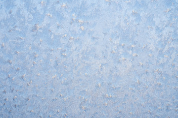 The patterns made by the frost on the window. Frosty winter background photo