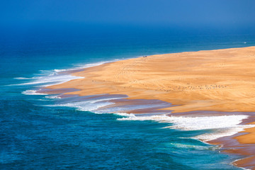 Scenic view of surf beach and ocean near Nazare Portugal