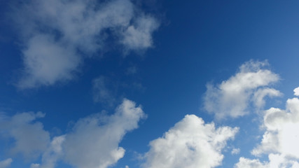 Clouds on a blue sky in cold winter day