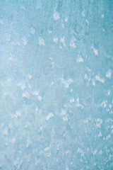Frosty christmas pattern at a winter window glass
