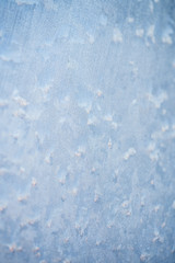 The patterns made by the frost on the window. Frosty winter background photo