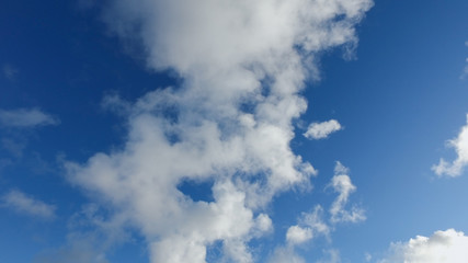 Clouds on a blue sky in cold winter day