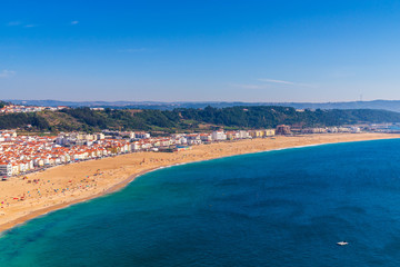 From the high point of the Nazare we can see the beach the sea and the village Nazare, Portugal