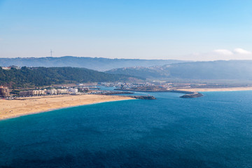 From the high point of the Nazare we can see the beach the sea and the village Nazare, Portugal