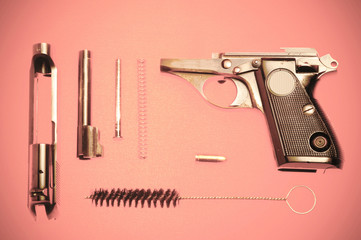 Disassembled pistol and cartridge