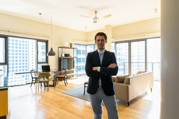 Young handsome businessman relaxing in the living room