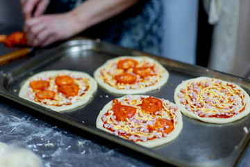 different kinds of pastry are being cooked