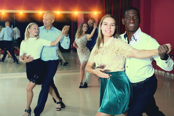 People dancing samba in pairs